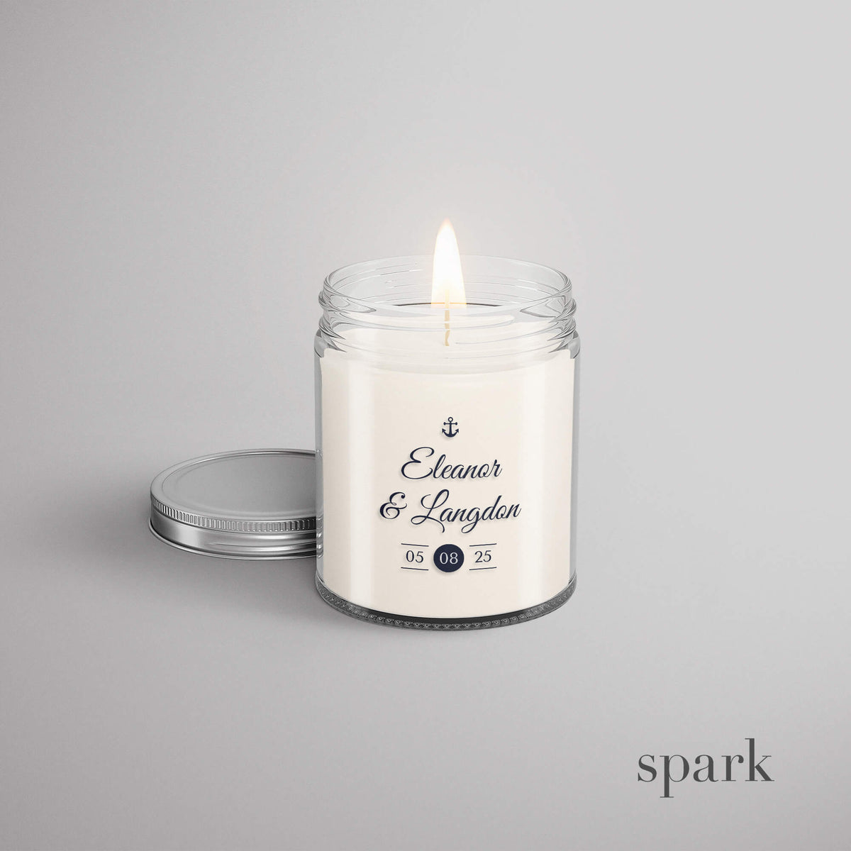 Custom wedding candle with bride and groom names and event date in 4oz clear glass style with silver lid
