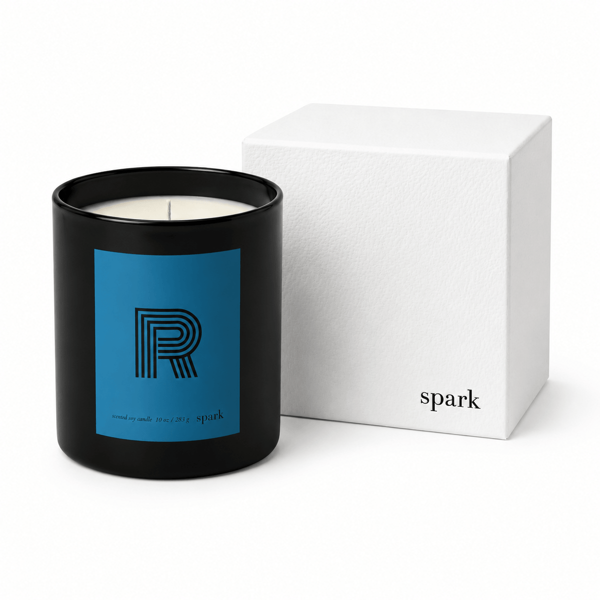 Black candle with blue label and white box on a white background